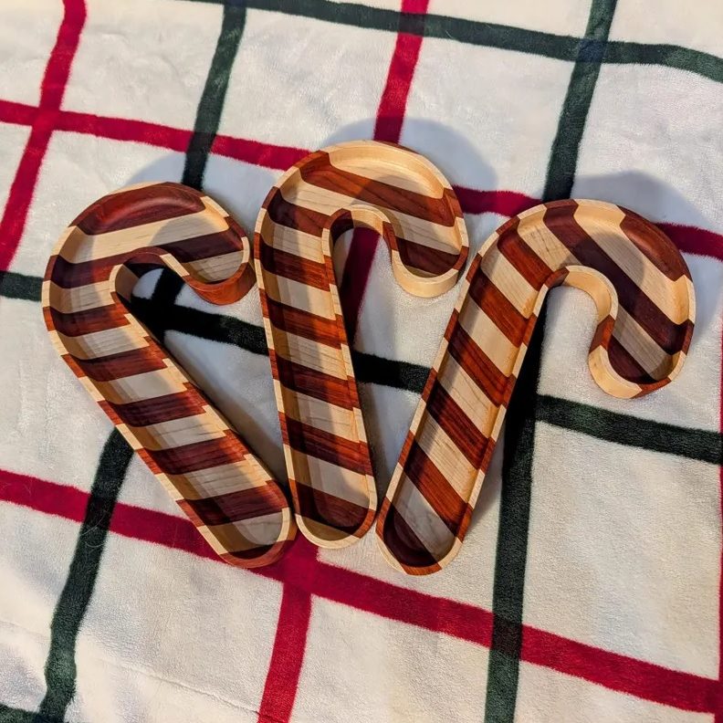Candy Cane Charcuterie Trays, handmade out of African Paduak and Maple wood. Made by Golden Grain Studio