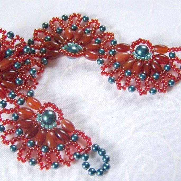 Handcrafted beadwoven bracelet with natural gemstones and intricate beadwork displayed on wrist